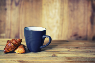 tea cup croissant breakfast