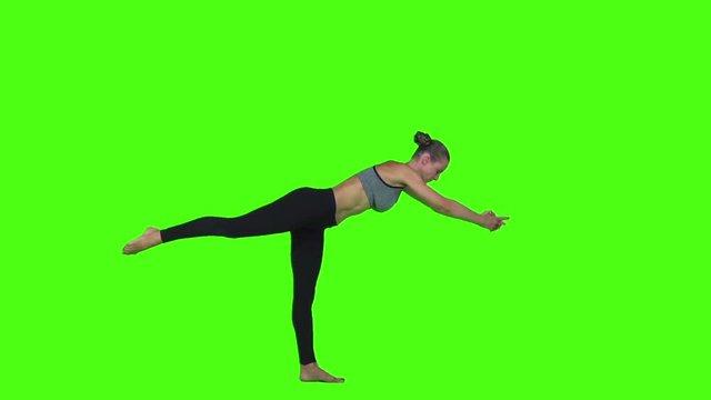 Gorgeous young woman practicing yoga. Green screen. Slow motion