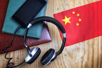 headphones and flag on a wooden background
