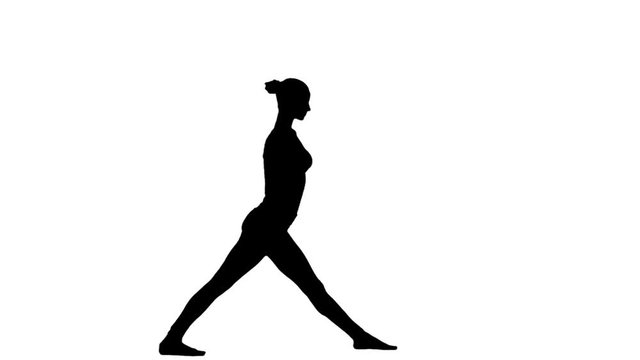 Woman is practicing yoga. White. Slow motion. Silhouette