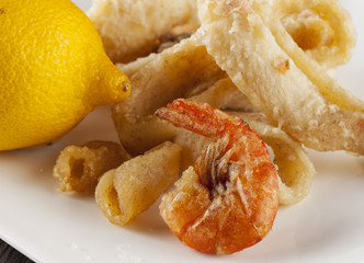 Fried fish over white plate