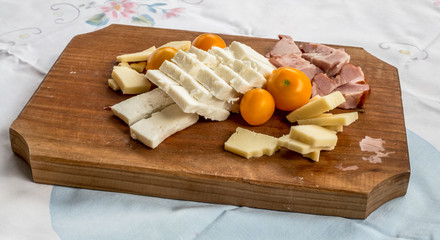 Breakfast served on a light wooden board