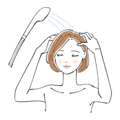 髪を洗い流す女性