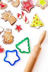 Christmas cookies with a rolling pin on a white background