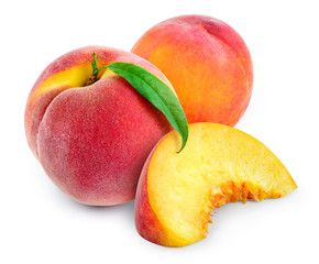 Peach with slice and leaf isolated on white. With clipping path.