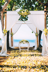 perfect wedding reception, ceremony venue on beach with flower details and ocean view