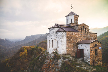 Fototapeta na wymiar The antique church in the mountains