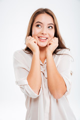 Fototapeta premium Portrait of a casual happy wondering woman thhinking about something