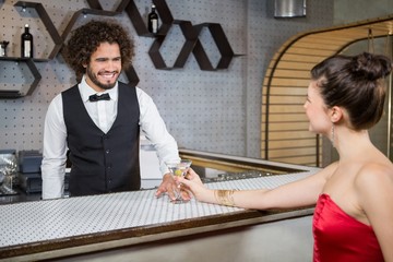 Waiter interacting with beautiful woman