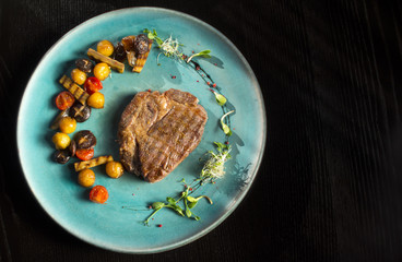 Grilled steaks and vegetables