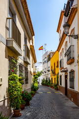 Fototapeta na wymiar Beautiful narrow street in Almunecar (Almuñécar) old town, Spain 