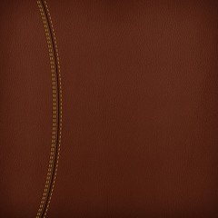 Texture of brown leather background with stitched seam, close-up. Texture for design.