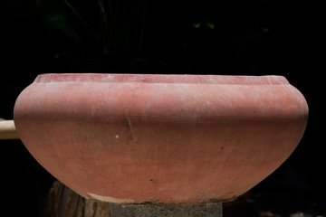 Fototapeta premium Old ceramic bowl on a black background