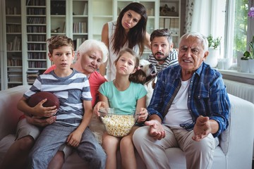 multi-generation family watching soccer match