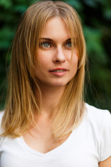 Naklejka premium Portrait of student on background green trees,