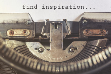 Find inspiration motivational message written with a vintage typewriter