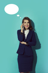 Young, confident, successful happy and beautiful business woman with the mobile phone isolated, Looking to the left. with comic speech bubbles icon