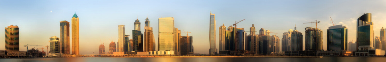 Fototapeta na wymiar Panoramic view of Business bay and downtown area of Dubai at sunrise, UAE