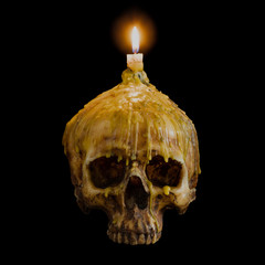 skull with candle light on top with clipping path on black backg