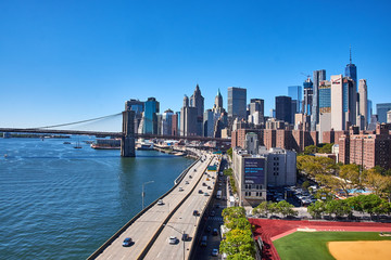 A look down the east coast of Manhattan with the FDR Drive and East River on the border and...