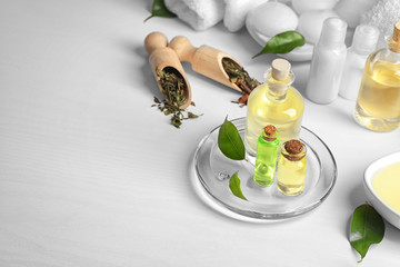 Spa composition with tea tree oil on white background