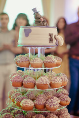 Wedding cake made of teddy bears and white cupcakes