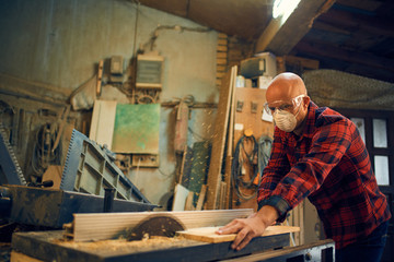 Carpenter at work at his workshop