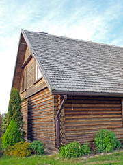 Part of house with weathered wood shingle roof 3