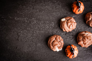 Eclairs with halloween decoration on black background