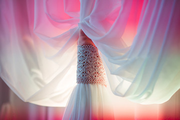 Delicate white curtains decorated with laces