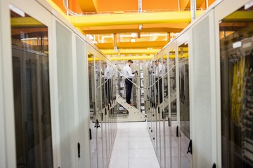 Fototapeta premium Technician using digital cable analyzer