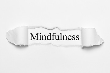 Mindfulness on white torn paper