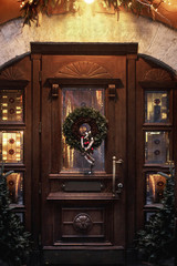 christmas wreath on wooden door. luxury decorated store front wi