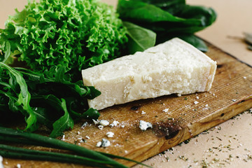 delicious fresh salad arugula spinach and parmezan cheese on woo