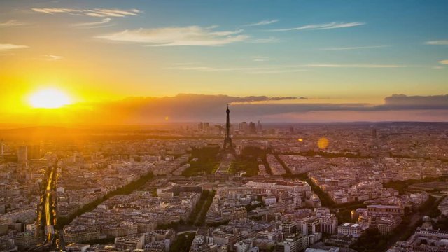 Time lapse footage of sunset over Eiffel Tower seen from Tour Montparnasse (Montparnasse 56), Paris, France.