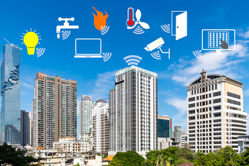 Smart Building and Internet of Things concept. Smart building management icons on Building in the city background.