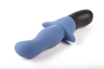 Sex toy dildo vibrator blue on white background
