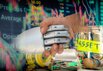 ROBO Advisor concept. Man and robot hand shaking  on abstract investment management background.