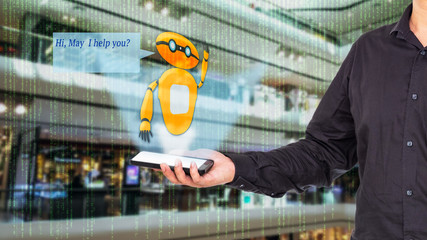 Augmented reality chatbot for retail business concept. Man holding smart phone with A/R chatbot and greeting message on blur department store background.