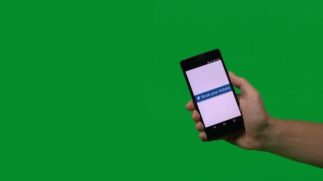Book tickets using a mobile phone - shot on green screen so it is easy to replace the green with your travel website snapshot, event photos or travel destination video