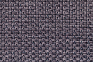 Dark brown textile background with checkered pattern, closeup. Structure of the fabric macro.