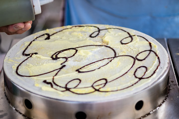 Cooking pancake or Crepes Thai style. (Selective focus)