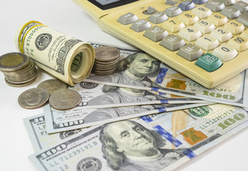 Fototapeta premium 100 US dollars bank notes and money coins. with computer keyboar