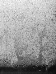 Texture drops of water on the transparent glass
