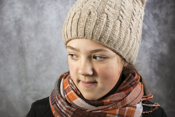 girl in knitwear cap and scarf