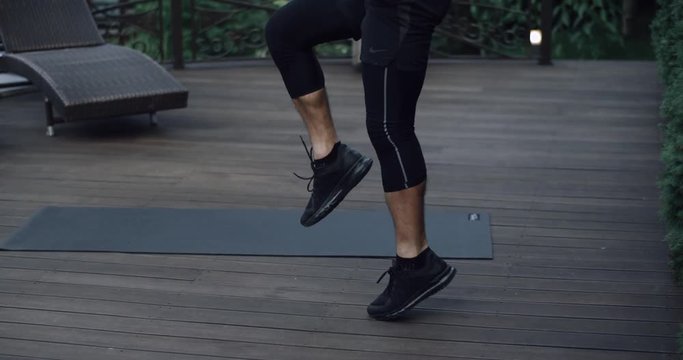 Young Athletic Man Doing Exercise In Gym. Plyometrics Exercise Strength Training By Fit Male Model Working Out. Shot On RED EPIC