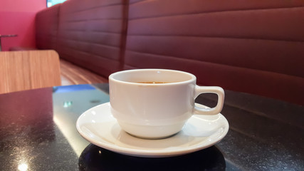 Cup of coffee. Drinking coffee. Cup of hot coffee on black table. White cup of coffee isolated. Cup of coffee on table. Cup of coffee background