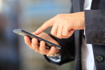 Businessman holding a smartphone
