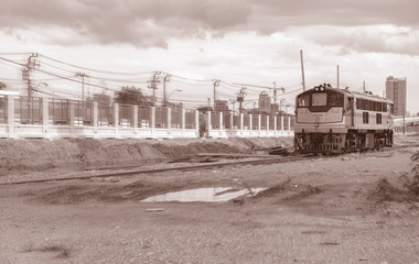 Fototapeta na wymiar Construction site / View of train run in construction site. Motion blur filter. Sepia tone.