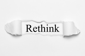 Rethink on white torn paper